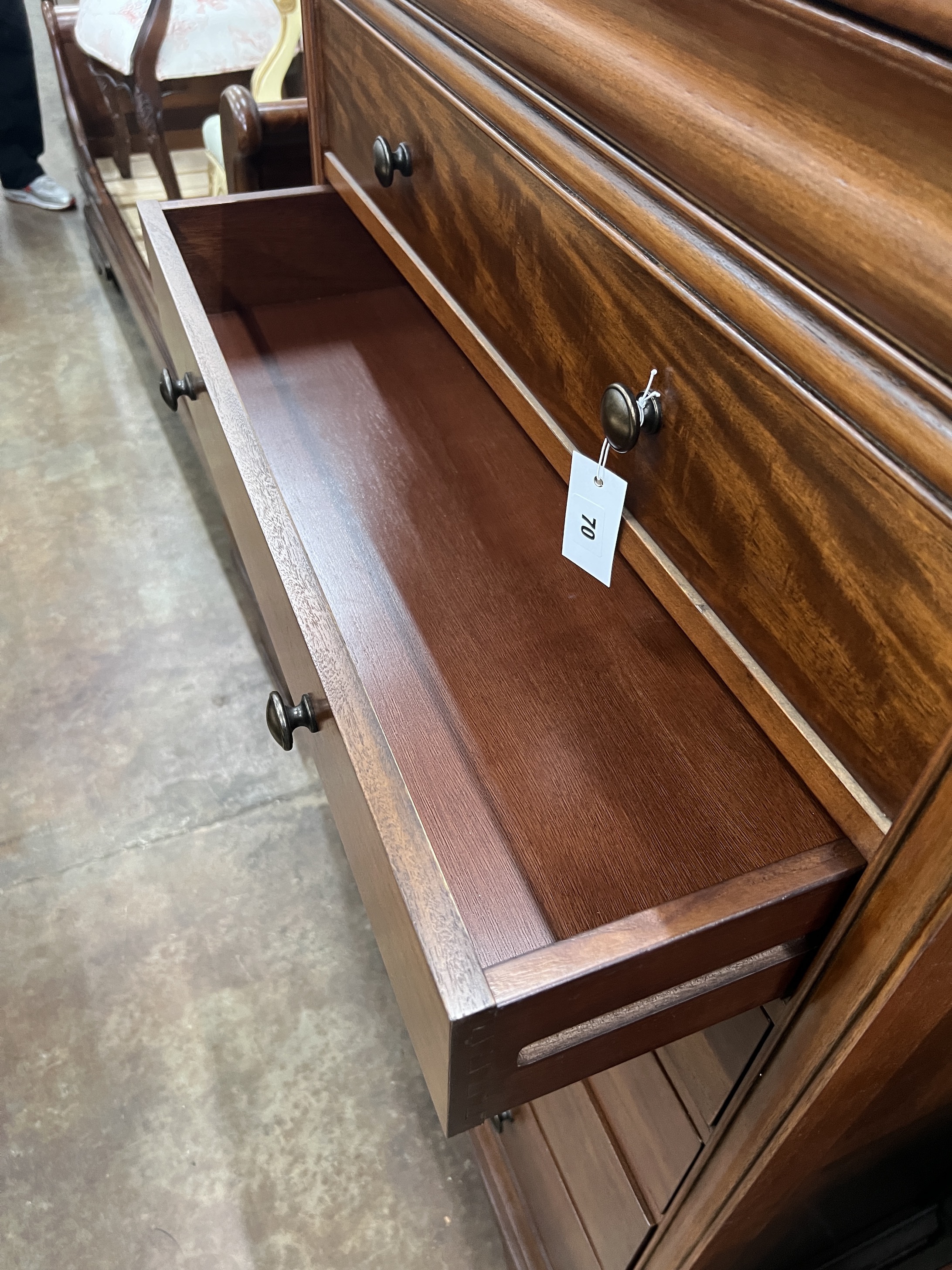 A contemporary five piece French mahogany bedroom suite, comprising sleigh bed, width 190cm, length 220cm, height 102cm (missing some bolts), a six drawer tall chest, three drawer chest and a pair of bedside chests